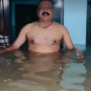 UP police Nishad Goes Viral for Worshipping Flooded Home as ‘Ganga Maa’ in Prayagraj"