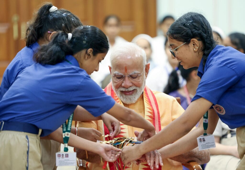 PM Modi Celebrates Raksha Bandhan with Students, Brahma Kumari Members