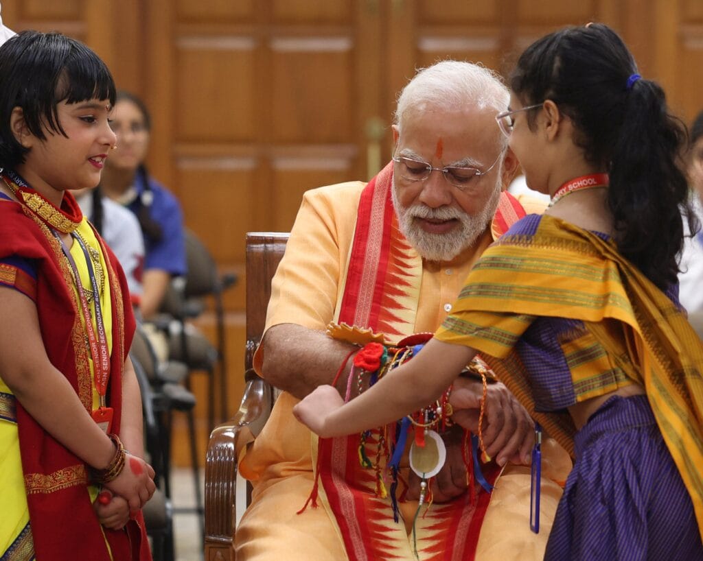 PM Modi Celebrates Raksha Bandhan with Students, Brahma Kumari Members